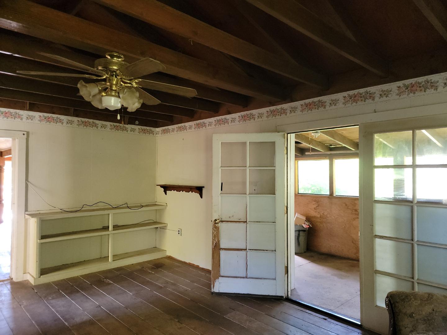159 Strawberry Road Watsonville, CA 95076 - Photo 61 of 109 a view of empty room with wooden floor and fan