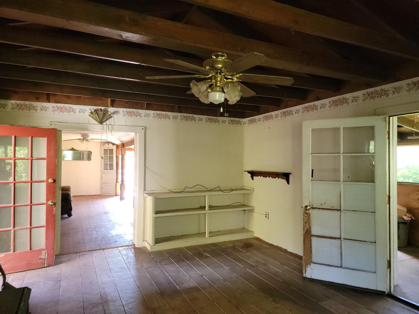 159 Strawberry Road Watsonville, CA 95076 - Photo 62 of 109 a view of empty room with wooden floor and cabinet