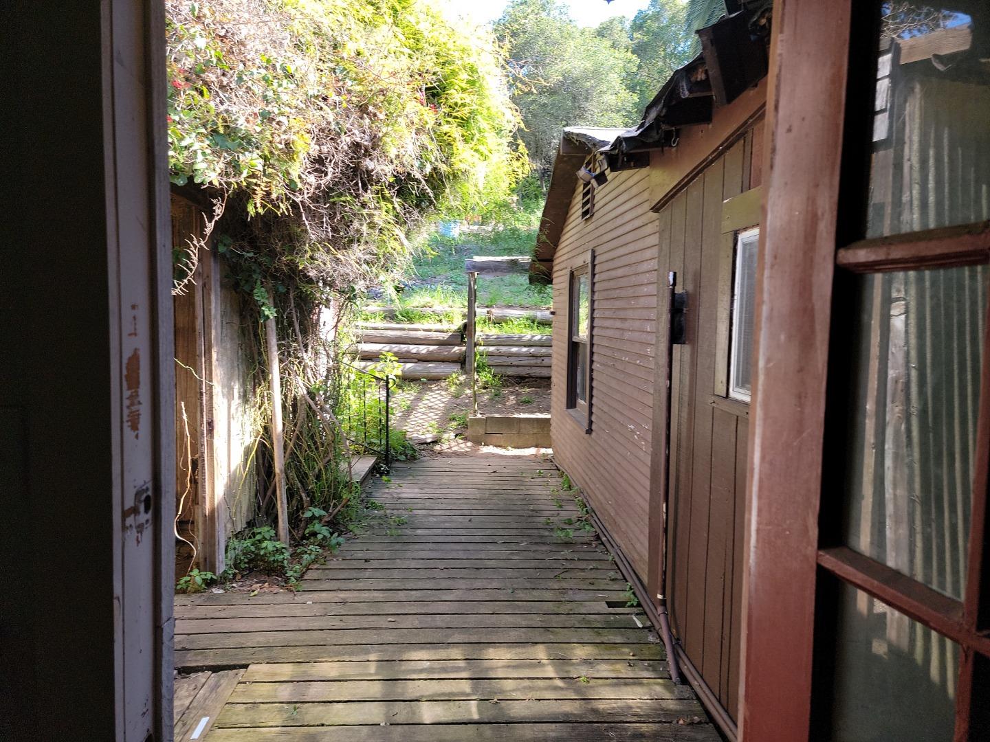 159 Strawberry Road Watsonville, CA 95076 - Photo 69 of 109 a view of a pathway of a house with backyard and wooden floor