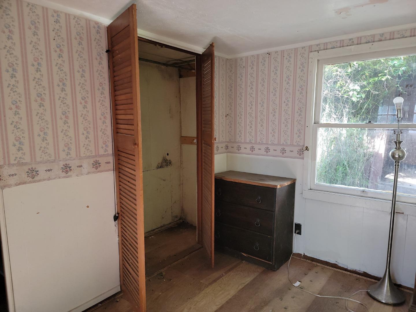 159 Strawberry Road Watsonville, CA 95076 - Photo 80 of 109 a room with a fireplace and a window