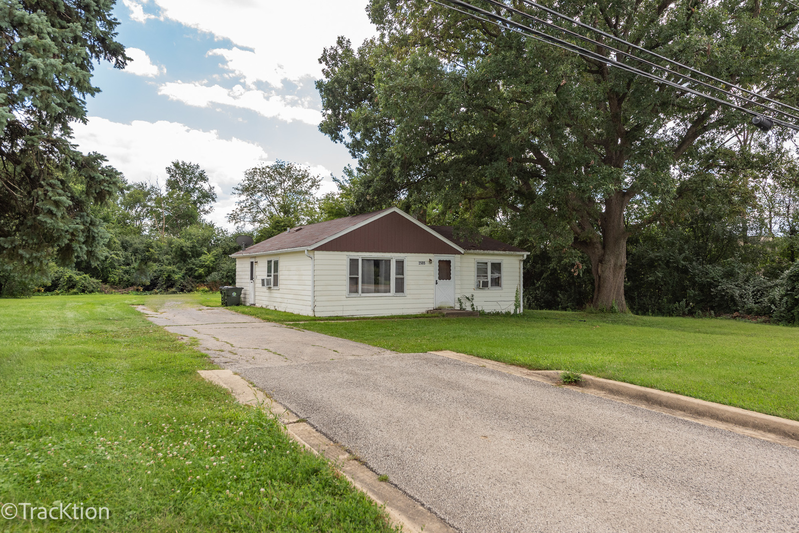 2505 75th Street Darien, IL 60561 - Photo 1 of 4 a front view of a house with garden