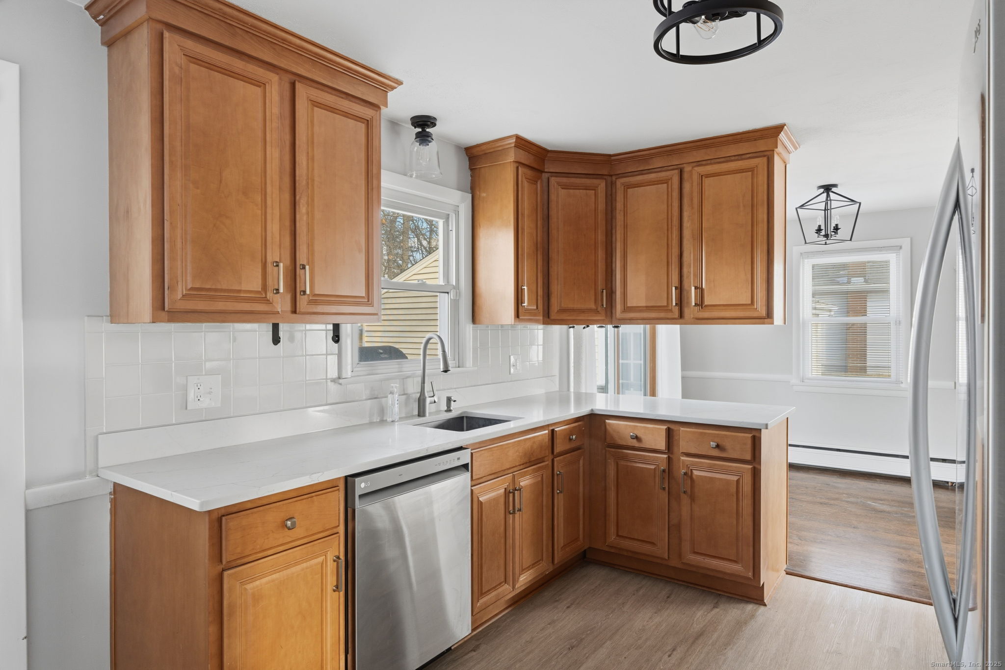 269 Great Swamp Road Glastonbury, CT 06033 - Photo 13 of 31 a kitchen with stainless steel appliances granite countertop a sink and dishwasher cabinets with wooden floor