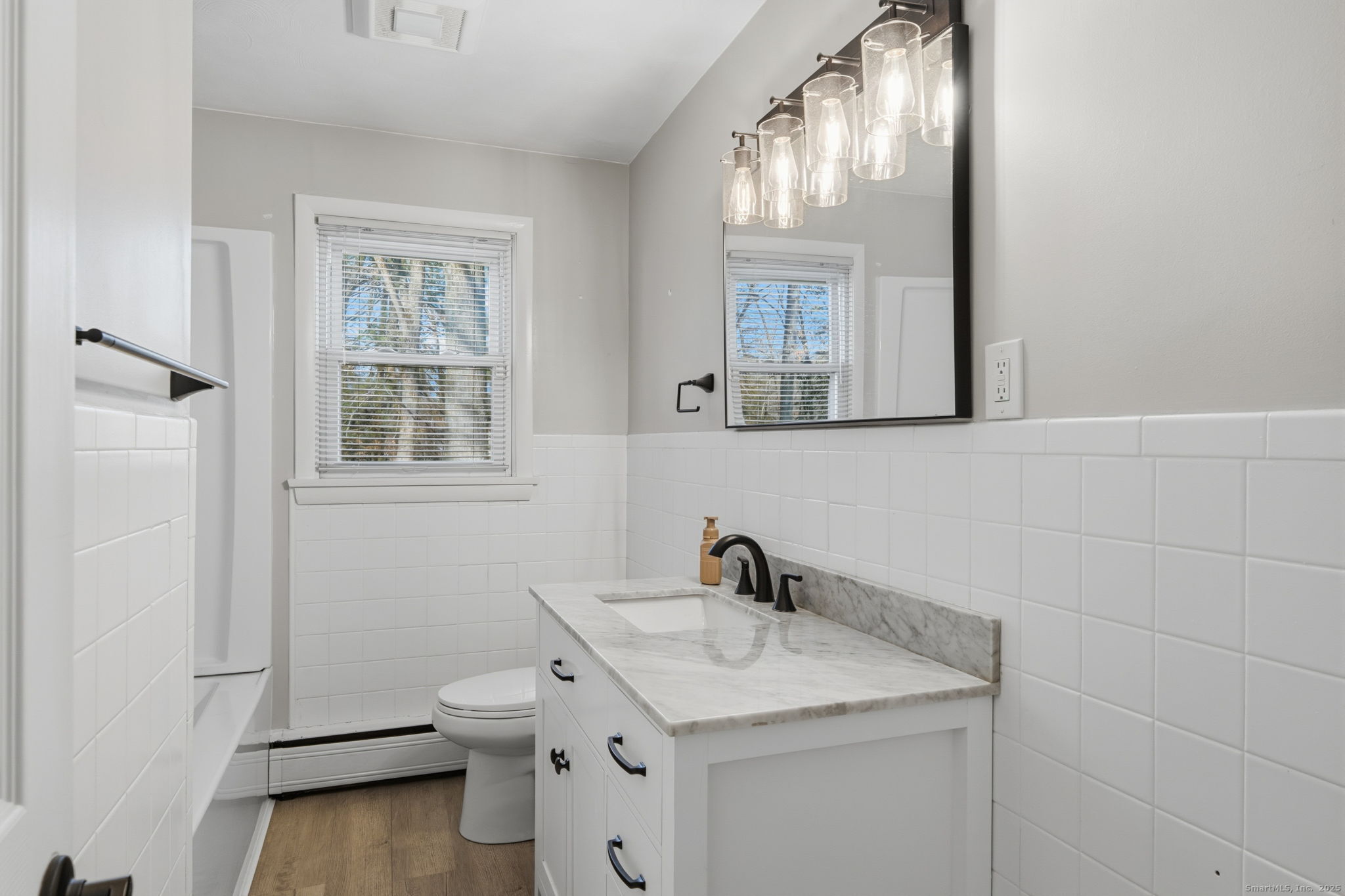 269 Great Swamp Road Glastonbury, CT 06033 - Photo 20 of 31 a bathroom with a toilet sink and mirror