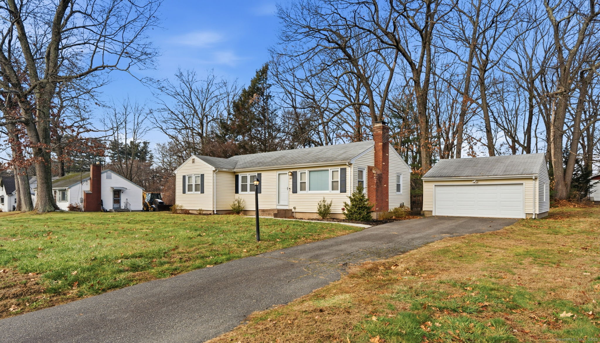 269 Great Swamp Road Glastonbury, CT 06033 - Photo 2 of 31 a front view of a house with a yard and trees