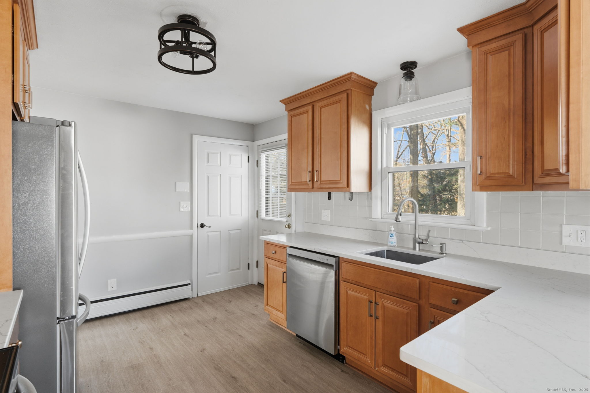269 Great Swamp Road Glastonbury, CT 06033 - Photo 9 of 31 a kitchen with stainless steel appliances granite countertop a sink a stove and a refrigerator