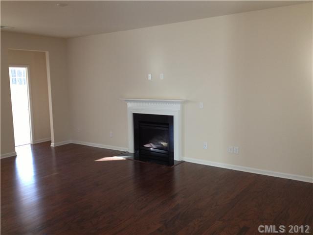 4017 Perth Road, Unit 400 Indian Land, SC 29707 - Photo 7 of 11 a view of an empty room with wooden floor and a window