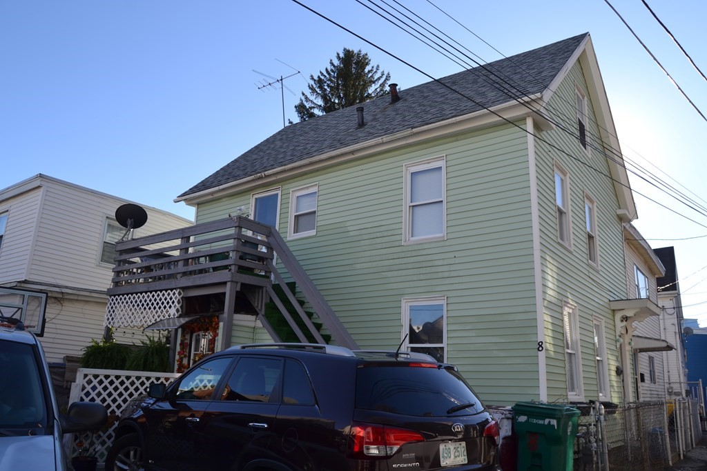 a car parked in front of a house
