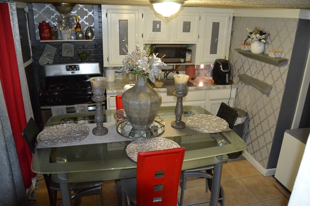 8 Cedar Court Lowell, MA 01852 - Photo 25 of 28 a view of a dining room with furniture a rug and wooden floor