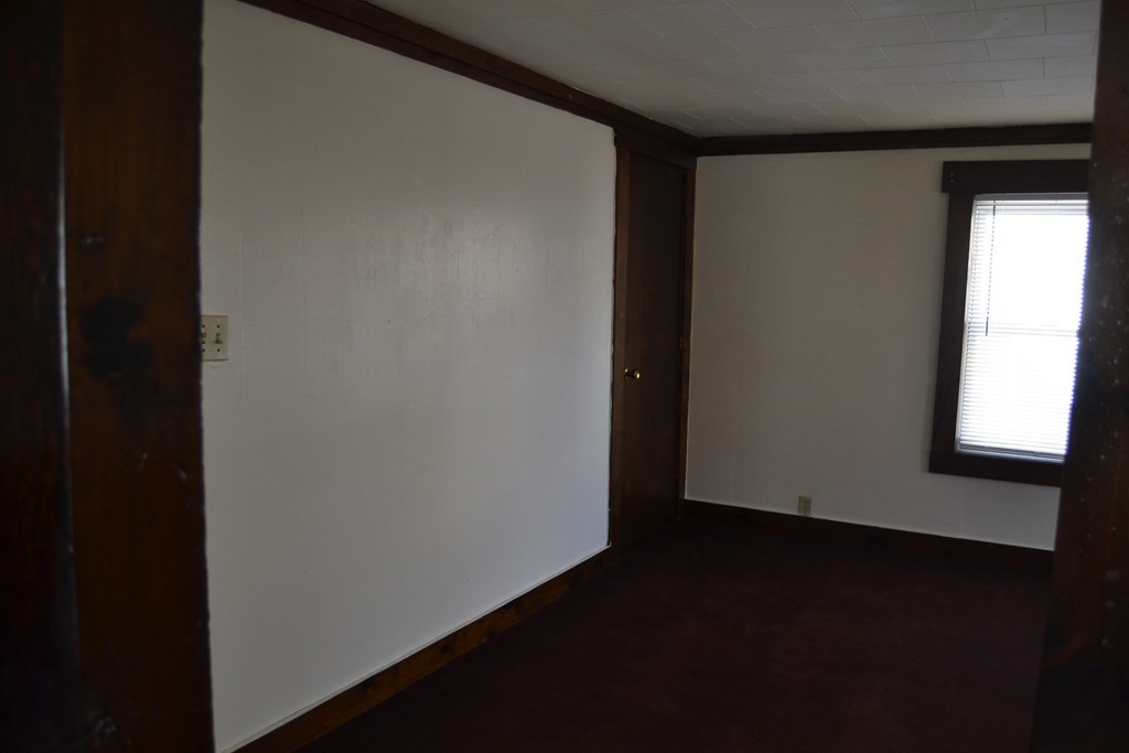 8 Cedar Court Lowell, MA 01852 - Photo 10 of 28 a view of small space with wooden floor and a window