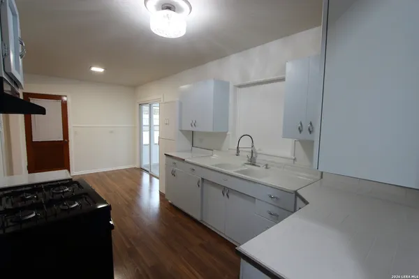 a kitchen with sink and stove
