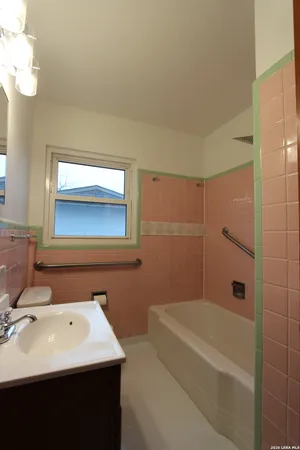 a terrace of a house with outdoor seating