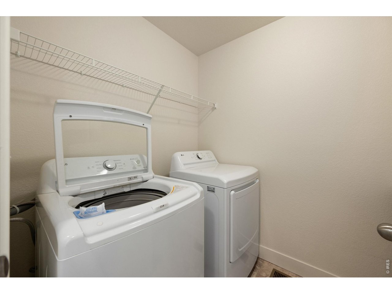819 Frst Cyn Road Severance, CO 80550 - Photo 28 of 42 Upstairs laundry with folding shelf