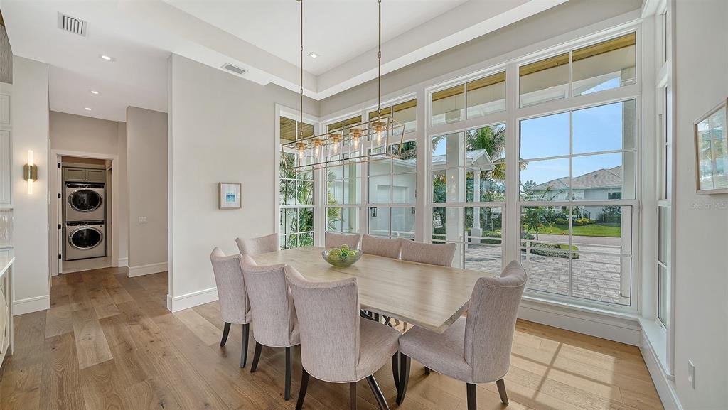 681 Old Compass Road Longboat Key, FL 34228 - Photo 11 of 67 a view of a dining room with furniture window and outside view