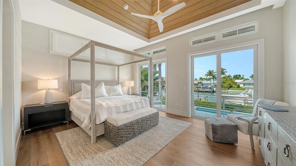 681 Old Compass Road Longboat Key, FL 34228 - Photo 18 of 67 a bedroom with a bed and a window