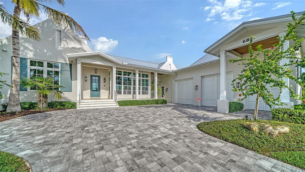 681 Old Compass Road Longboat Key, FL 34228 - Photo 2 of 67 a house view with a garden space