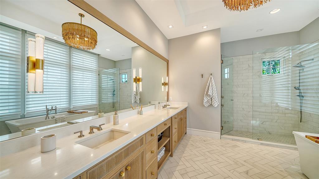 681 Old Compass Road Longboat Key, FL 34228 - Photo 23 of 67 a spacious bathroom with a double vanity sink mirror and shower