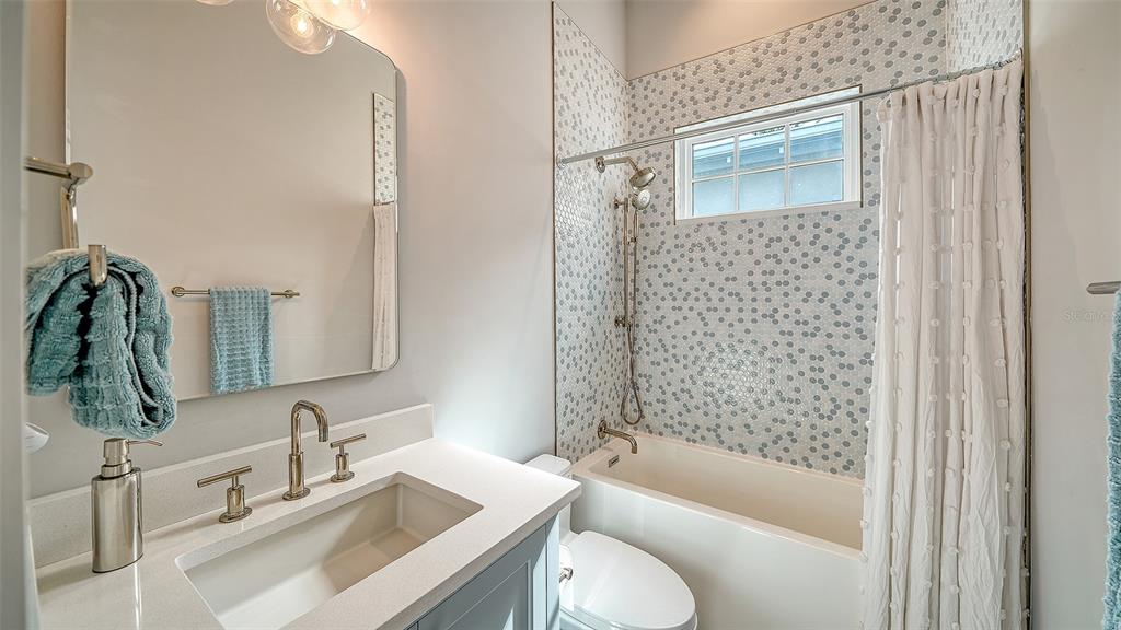 681 Old Compass Road Longboat Key, FL 34228 - Photo 28 of 67 a bathroom with a sink toilet tub and shower