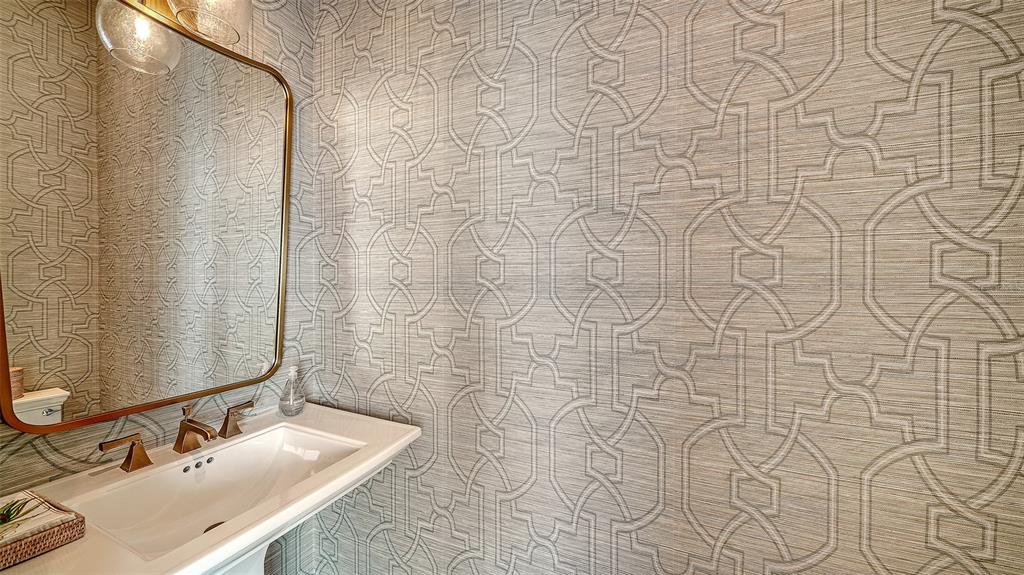 681 Old Compass Road Longboat Key, FL 34228 - Photo 29 of 67 a bathroom with a sink and a mirror