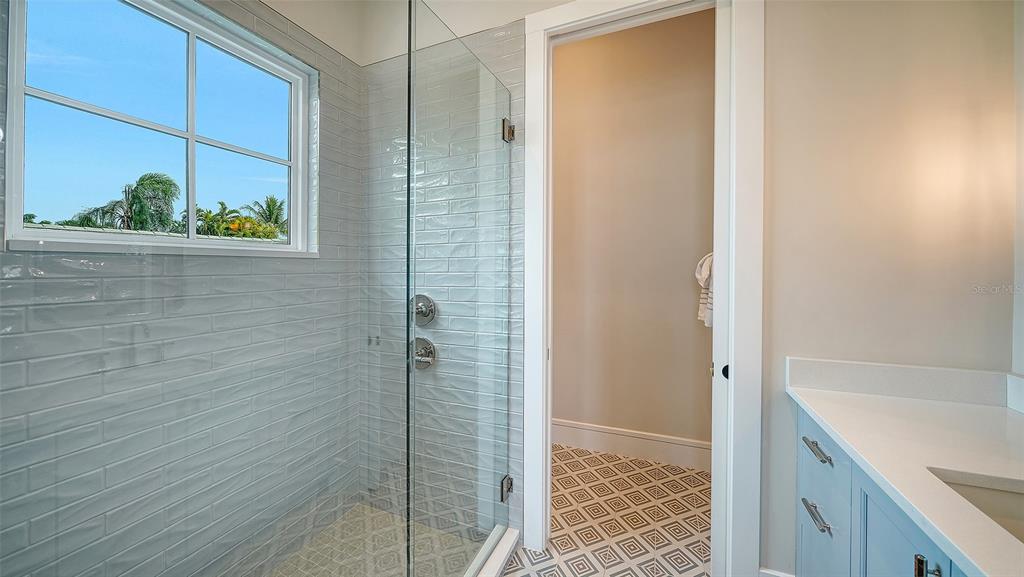 681 Old Compass Road Longboat Key, FL 34228 - Photo 33 of 67 a bathroom with a shower and a sink