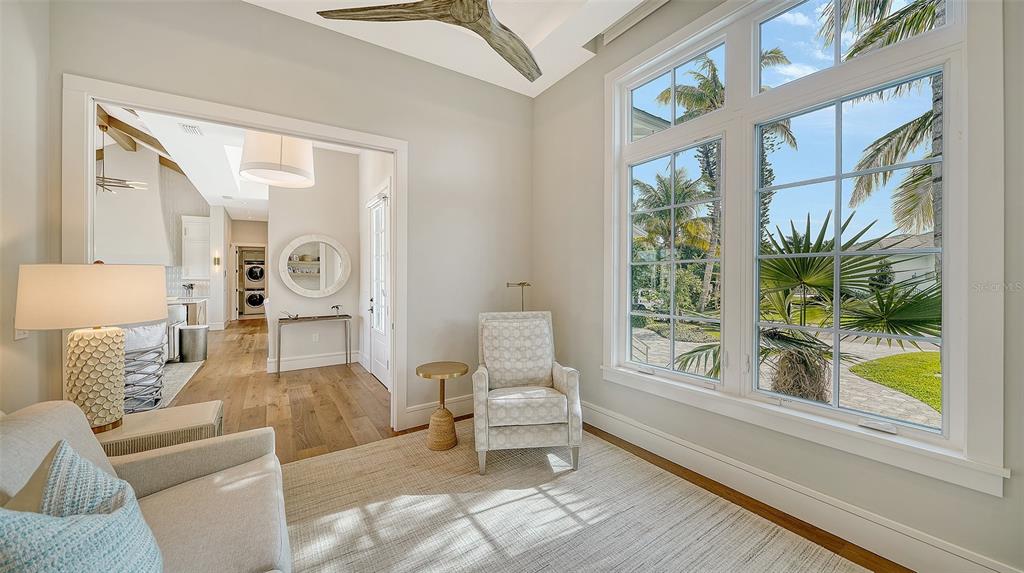 681 Old Compass Road Longboat Key, FL 34228 - Photo 37 of 67 a living room with furniture and a large window