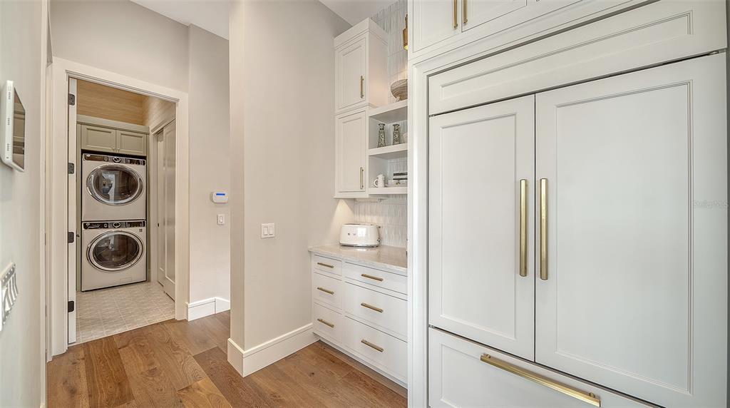 681 Old Compass Road Longboat Key, FL 34228 - Photo 38 of 67 a view of a storage and utility room with washer and dryer