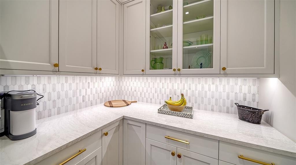 681 Old Compass Road Longboat Key, FL 34228 - Photo 40 of 67 a kitchen with a sink and a window