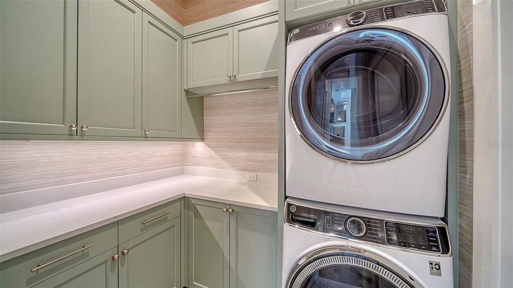681 Old Compass Road Longboat Key, FL 34228 - Photo 41 of 67 a utility room with dryer and washer