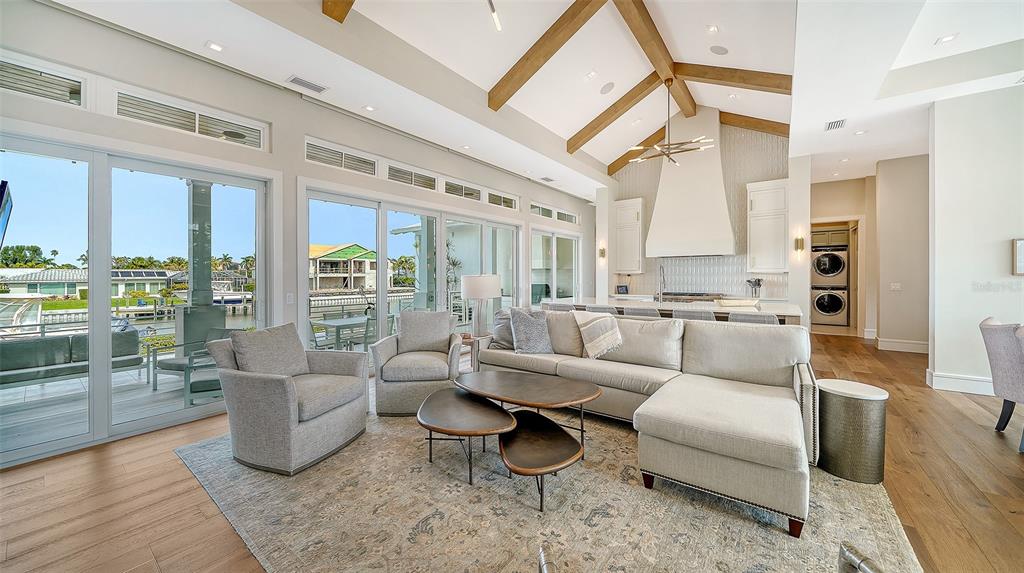 681 Old Compass Road Longboat Key, FL 34228 - Photo 5 of 67 a living room with furniture and a large window