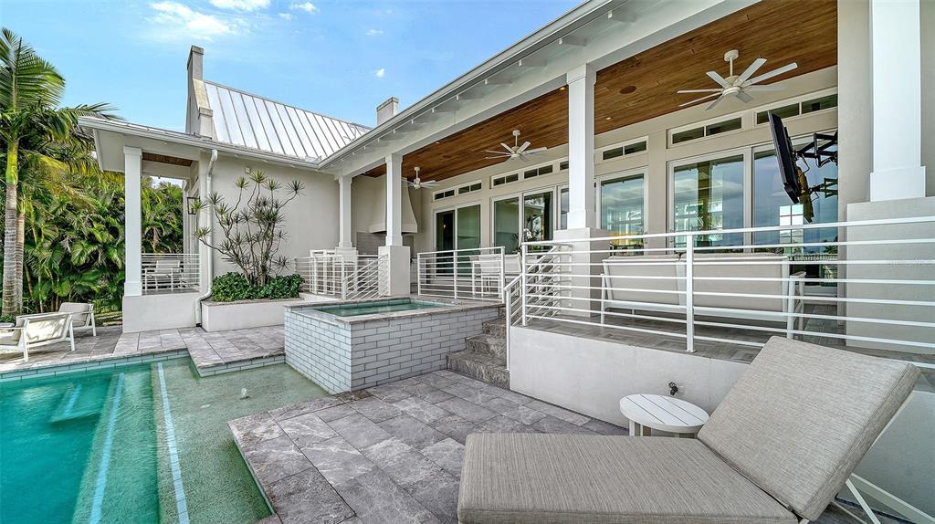 681 Old Compass Road Longboat Key, FL 34228 - Photo 51 of 67 a view of a patio with couches table and chairs and potted plants