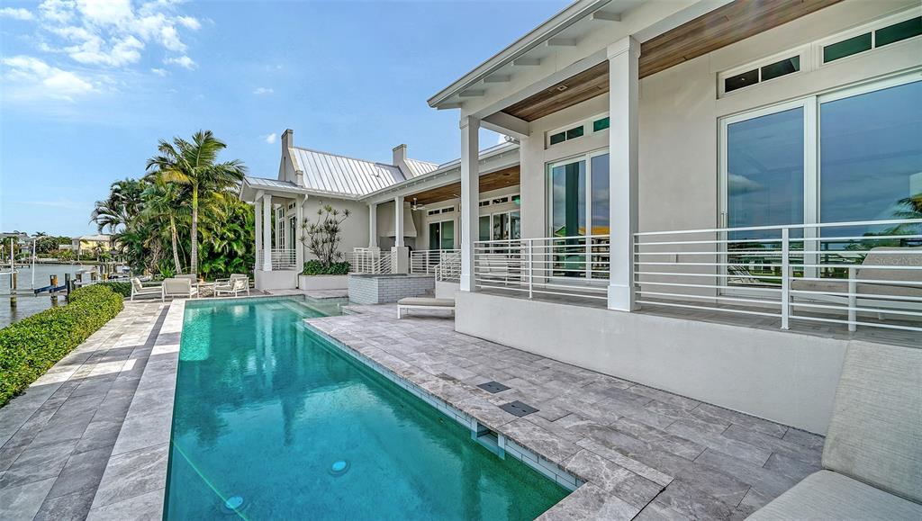 681 Old Compass Road Longboat Key, FL 34228 - Photo 53 of 67 a view of a house with a yard and sitting area