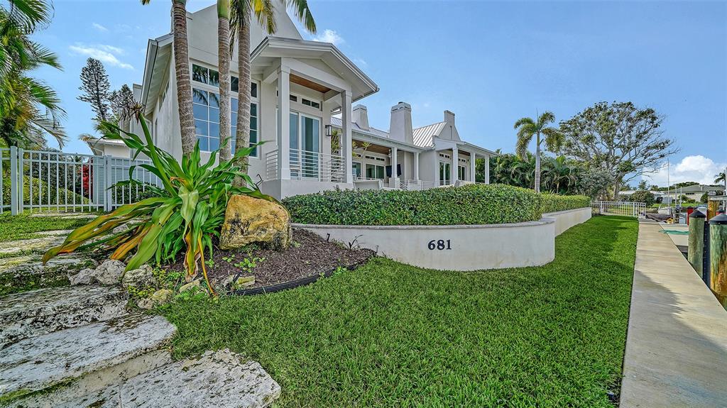681 Old Compass Road Longboat Key, FL 34228 - Photo 56 of 67 a view of a house with a yard and plants