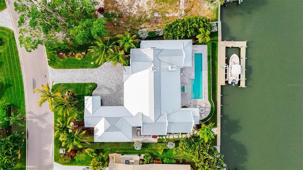 681 Old Compass Road Longboat Key, FL 34228 - Photo 59 of 67 an aerial view of a house with a yard and garden