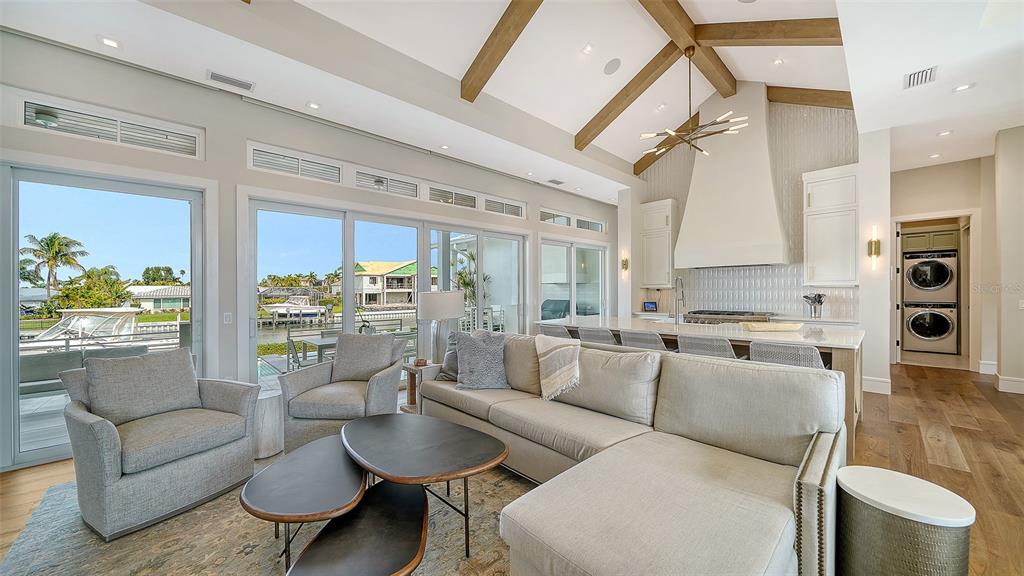 681 Old Compass Road Longboat Key, FL 34228 - Photo 6 of 67 a living room with furniture and a large window