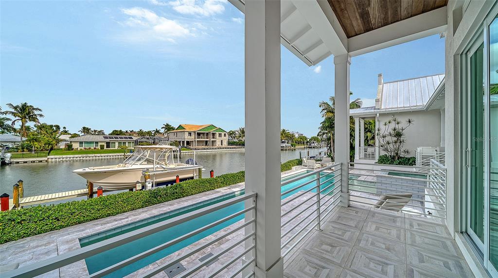 681 Old Compass Road Longboat Key, FL 34228 - Photo 65 of 67 a view of a balcony with lake view and wooden floor
