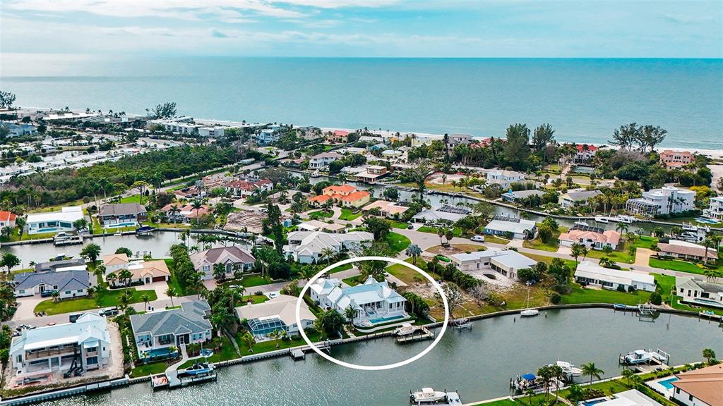 681 Old Compass Road Longboat Key, FL 34228 - Photo 67 of 67 an aerial view of a houses with a parking space