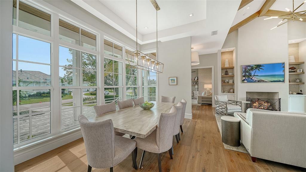 681 Old Compass Road Longboat Key, FL 34228 - Photo 10 of 67 a view of a dining room with furniture window and wooden floor