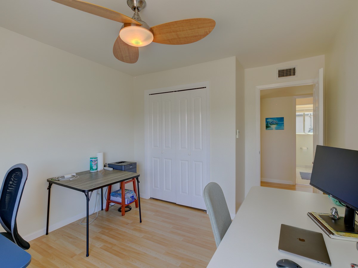 710 Castle Ridge Road, Unit B Austin, TX 78746 - Photo 20 of 27 Well-lit room with wood flooring, offering a versatile space for work or rest.