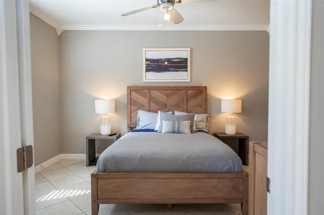 a bedroom with a bed and lamps