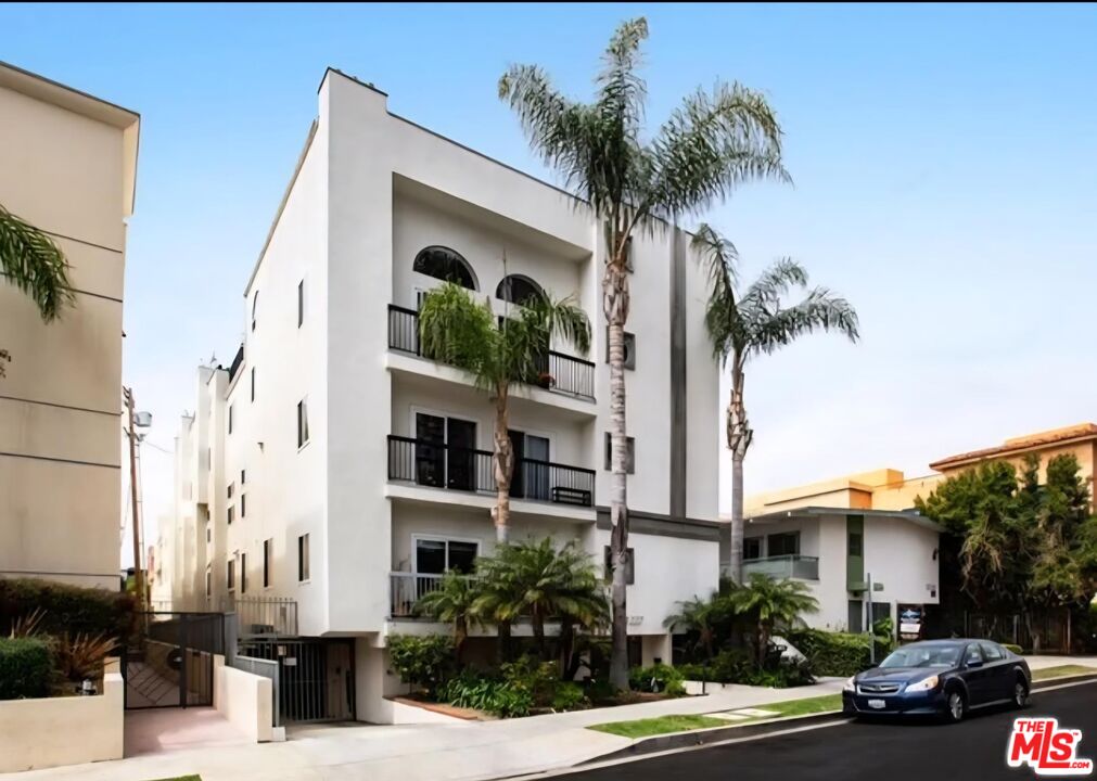 1227 Granville Avenue, Unit PH2 Los Angeles, CA 90025 - Photo 2 of 2 a view of a street with palm trees