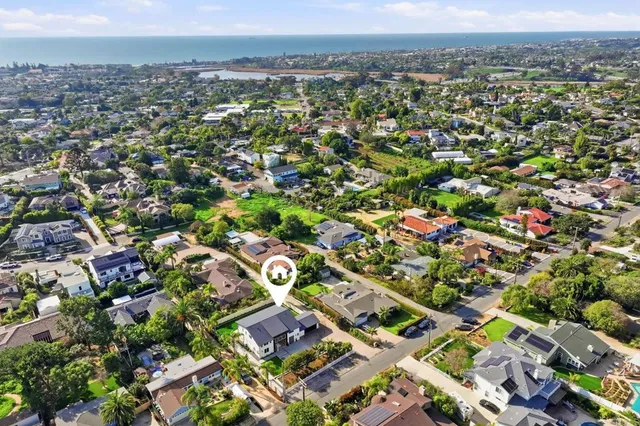 an aerial view of a house with a garden