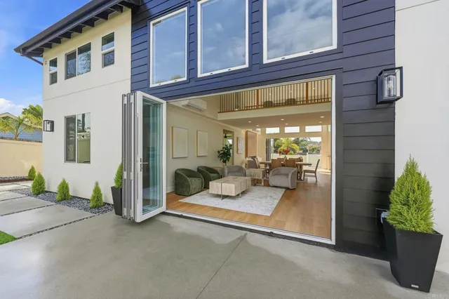 an aerial view of a house with garden space and lake view
