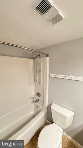 a bathroom with a toilet a sink and a bathtub