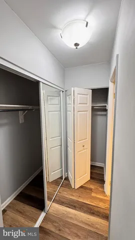 a view of an empty room with closet