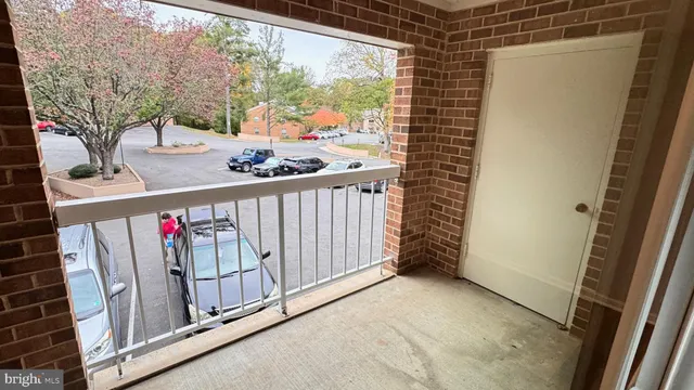 a view of a balcony with furniture