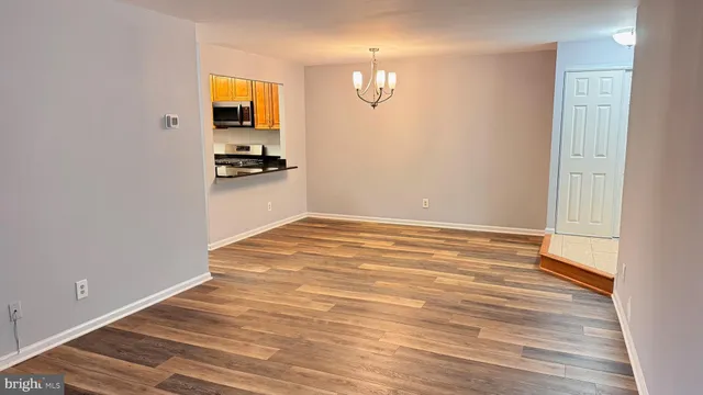 a view of a kitchen from the hallway