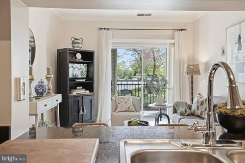 a kitchen with stainless steel appliances granite countertop a stove and a sink