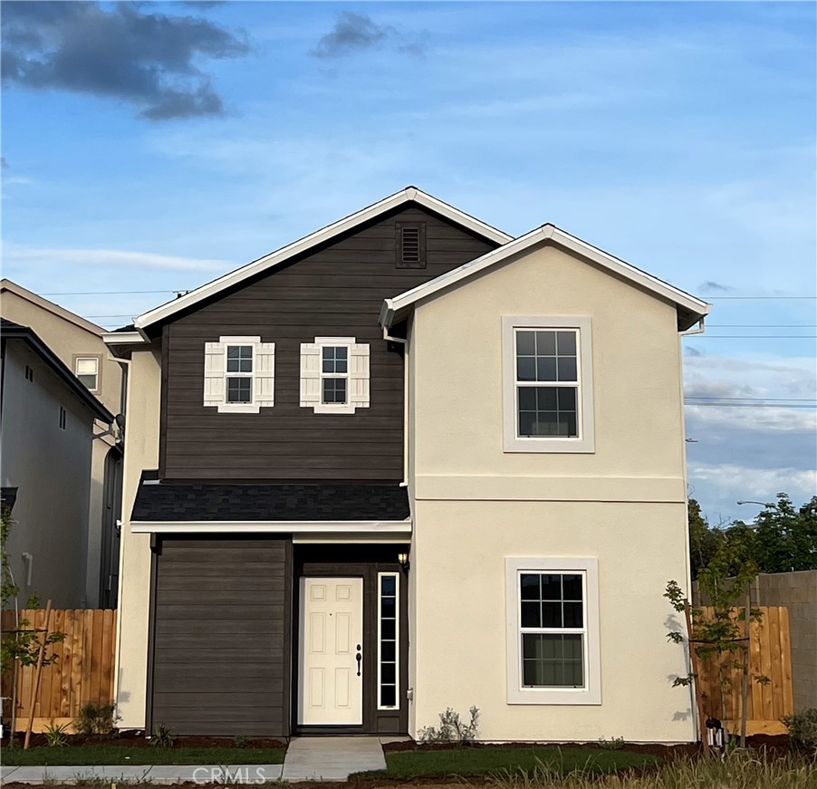 a front view of a house with garage