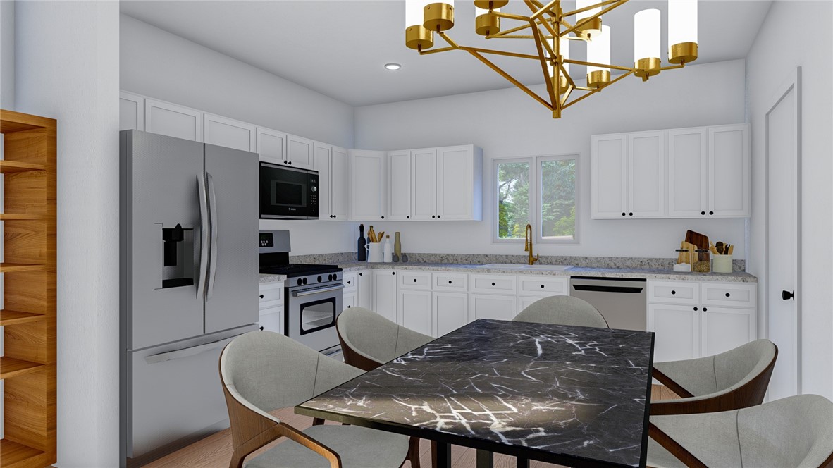 5024 Palisade Avenue Merced, CA 95348 - Photo 11 of 12 a kitchen with stainless steel appliances granite countertop a stove refrigerator sink and cabinets