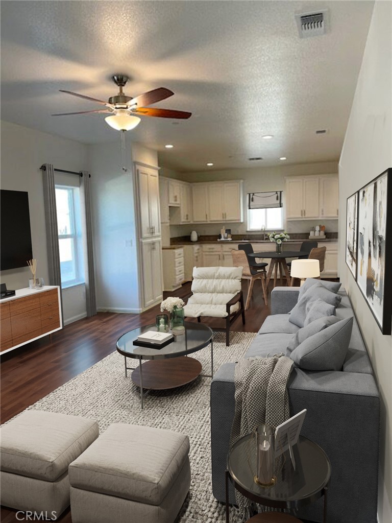 5024 Palisade Avenue Merced, CA 95348 - Photo 4 of 12 a living room with furniture and a chandelier
