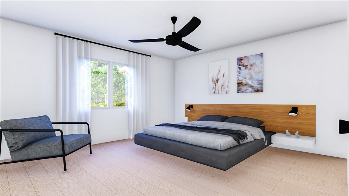 5024 Palisade Avenue Merced, CA 95348 - Photo 7 of 12 a bedroom with a bed and a couch